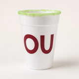 A white foam cup with a light green sugar-rimmed edge and the word 'OU' printed in dark red on the front, photographed on a clean off-white background.