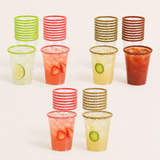 A set of clear plastic cups with colorful sugar-rimmed edges, shown both empty and filled with cocktails and garnishes on a clean white background.