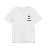 White t-shirt with a small logo on a white background