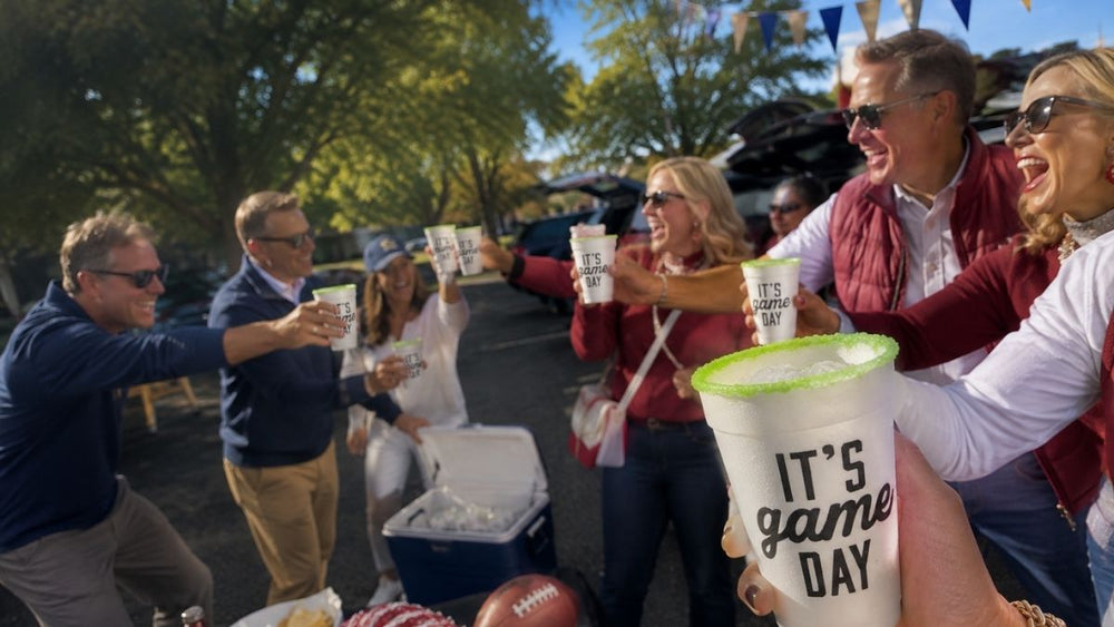 group of individuals at a tailgate with Rita Rims IT'S GAME DAY cups