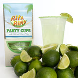 Rita Rims party cups with salt and lime rims, surrounded by limes and a cup of lime juice.