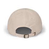 Adjustable fabric strap and antique brass buckle on the Tailgate MVP cap in cream. 